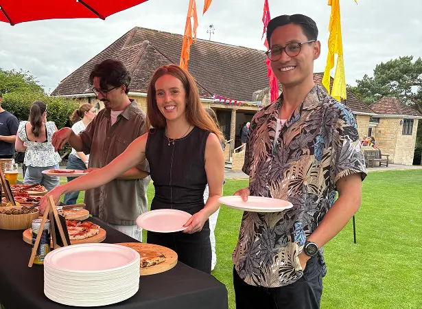 Guests enjoying stone baked pizza at a corporate event catered by The Piccolo Box