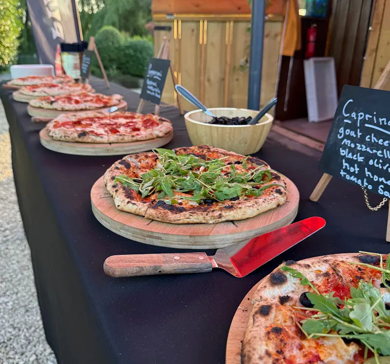 Selection of gourmet stone baked pizzas prepared by The Piccolo Box for wedding guests