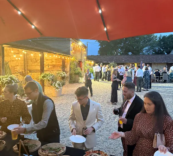 Guests enjoying wedding pizza catering