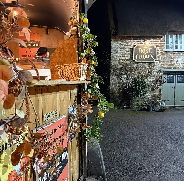 The Piccolo Box mobile pizza van set up outside a countryside venue for evening wedding catering