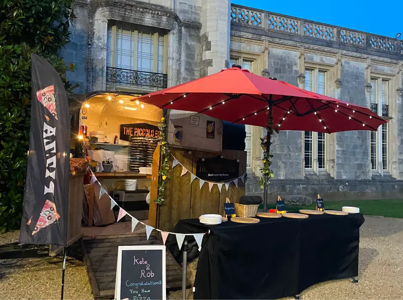 The Piccolo Box mobile pizza catering setup at an elegant wedding venue